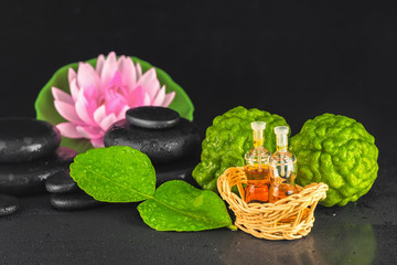 spa concept of bergamot, leaf, fragrance oil, lotus and zen basa