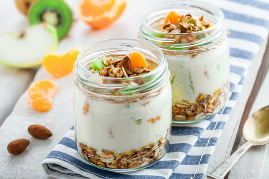 Healthy meal made of granola, yogurt and fruits. Delicious food for breakfast. Traditional American snack.