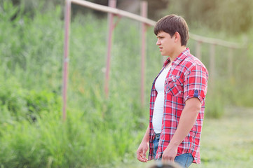 young man in a plaid shirt