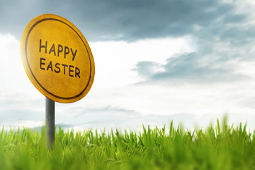 Happy Easter greeting on traffic sign in a grass field