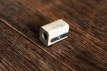 Wooden sharpener, old, school supplies. Close view.