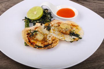 Baked scallops with spinach