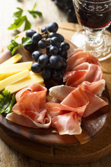 Cheese board with glass of wine