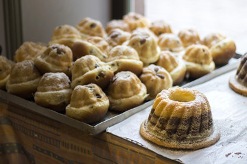 traditional alsatian kouglouf cakes behind shop window