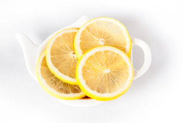 Lemon sliced lies on a plate shaped