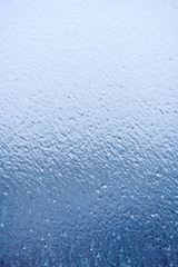 Blue ice on glass,  background, texture