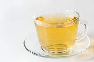 Glass cup with green tea on white background.