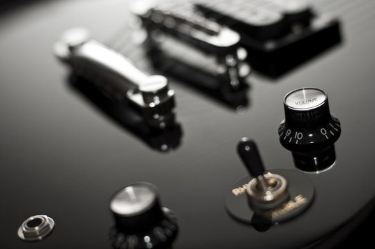 Detail of a black electric guitar