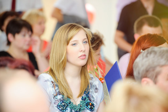 Young Pensive Woman In The Crowd