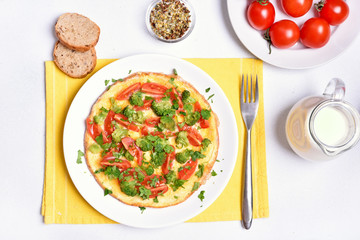 Omelet with vegetables, top view.