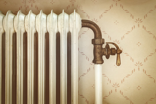 Retro styled image of an old central heating radiator