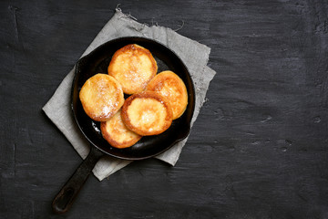 Cheese pancakes in frying pan