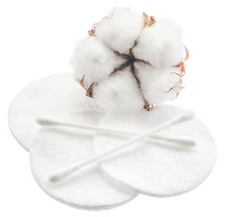 Fluffy cotton ball and cotton swabs and pads.