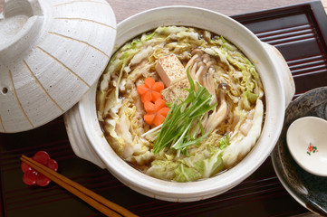Mille-Feuille Nabe  is a simple Japanese hot pot that is made with napa cabbage and pork belly slices cooked in a savory dashi broth.