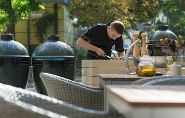 Barbecue chef tasting outdoor kitchens