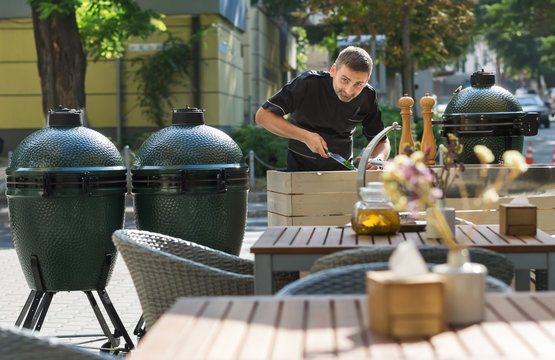 Barbecue chef tasting outdoor kitchens