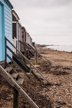 A Row of Beach Huts stretching along the coastline
