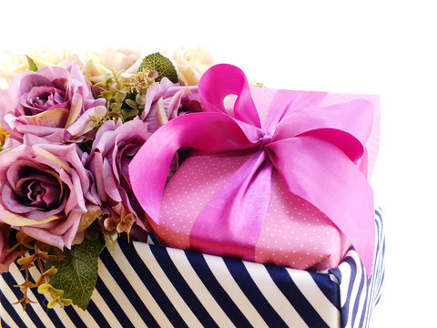 present gift box and flowers artificial bouquet on white background