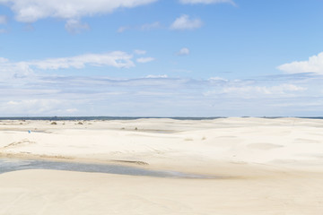 Fototapeta na wymiar Water channel and Dunes in the Tavares beach