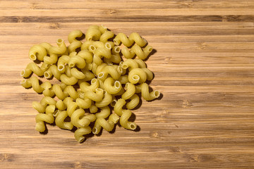 pasta spiral on a wooden Board
