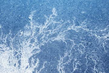 Obraz premium Asphalt road covered with ice, background. Toned