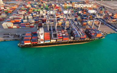 Ship for container with working crane bridge in shipyard for Logistic Import Export background