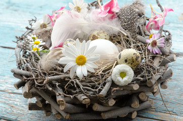 Happy Easter: beautiful Easter nest with Easter eggs, feathers and spring flowers :)