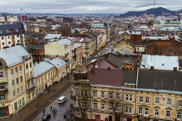 Naklejka premium Old Lviv in Ukraine. The view from the city hall of the city and the mountain High castle. February 2016