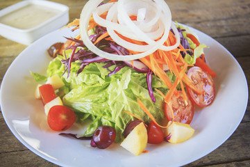 Vegetable and fruit salad in vintage style