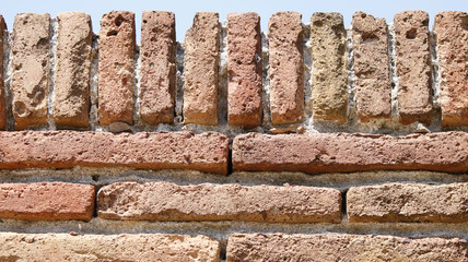 An old fortification wall made of flat bricks