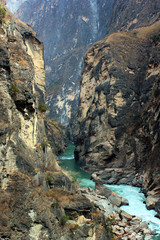 Fototapeta na wymiar Yangtze river in the most narrow part of Tiger Leaping Gorge. Yunnan, Southern China