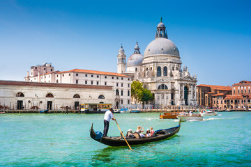 Fototapeta na wymiar Gondola on Canal Grande with Basilica di Santa Maria della Salute, Venice, Italy