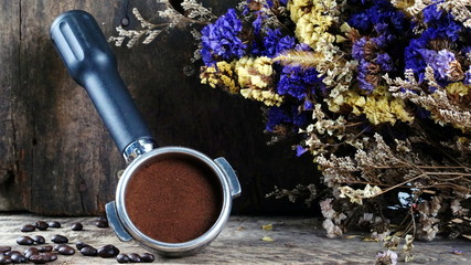 Dark roasting coffee beans. on the wood table.