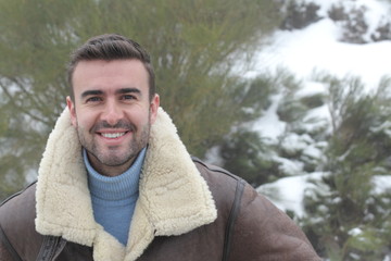 Handsome man smiling in the winter cold weather