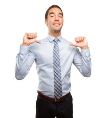 Satisfied businessman doing a victory gesture