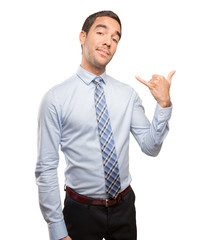 Confident young businessman doing a call gesture
