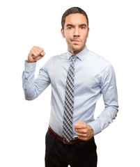 Serious young businessman posing