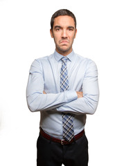 Serious young businessman posing