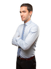 Serious young businessman posing