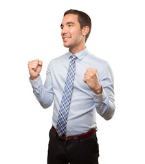 Victorious young businessman celebrating