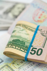 American money is on the top of the opened passport