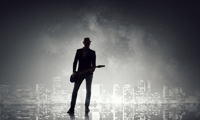 Obraz premium Elegant guitarist silhouette . Mixed media