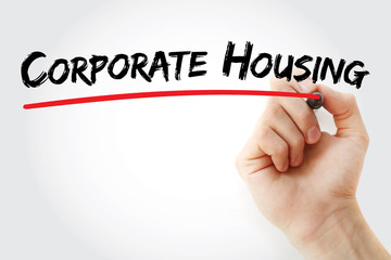Hand writing corporate housing with marker, concept background
