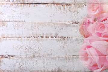 white wooden background with rose pattern border