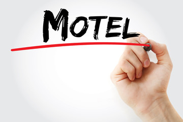 Hand writing motel with marker, concept background