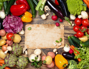 Fresh vegetables on wooden background.