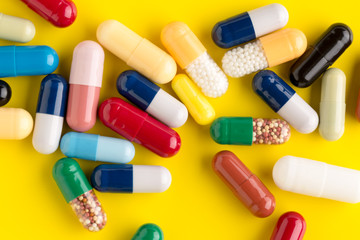 Pills different on color background