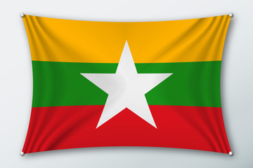 Myanmar national flag. Symbol of the country on a stretched fabric with waves attached with pins. Realistic vector illustration.