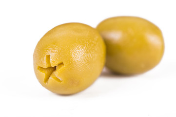 Two olives from different sides on a white background