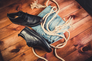 Black leather men's shoes on a wooden background
